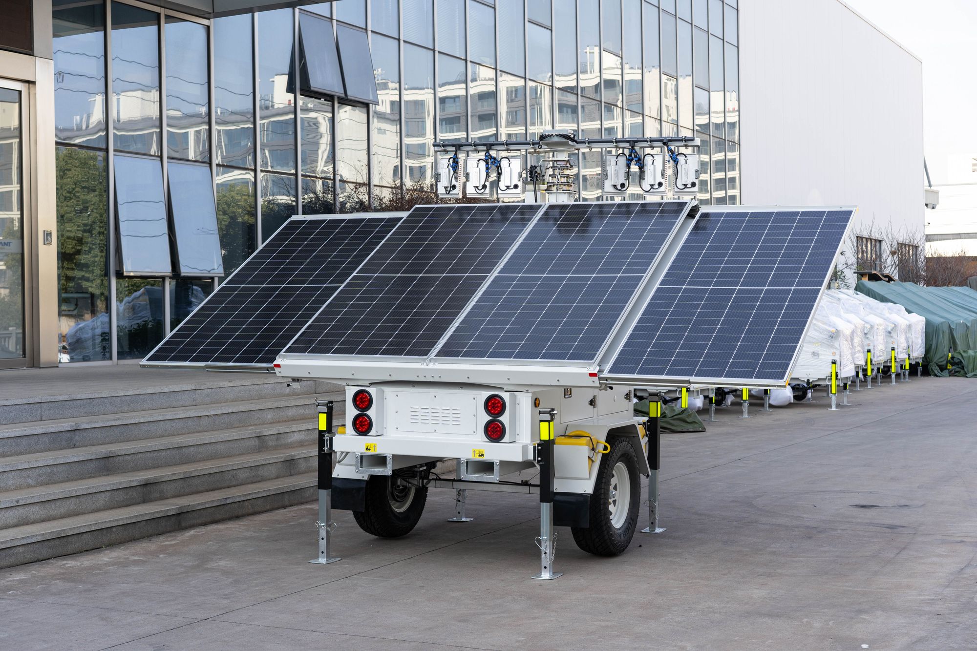 A mobile solar panel trailer parked outdoors