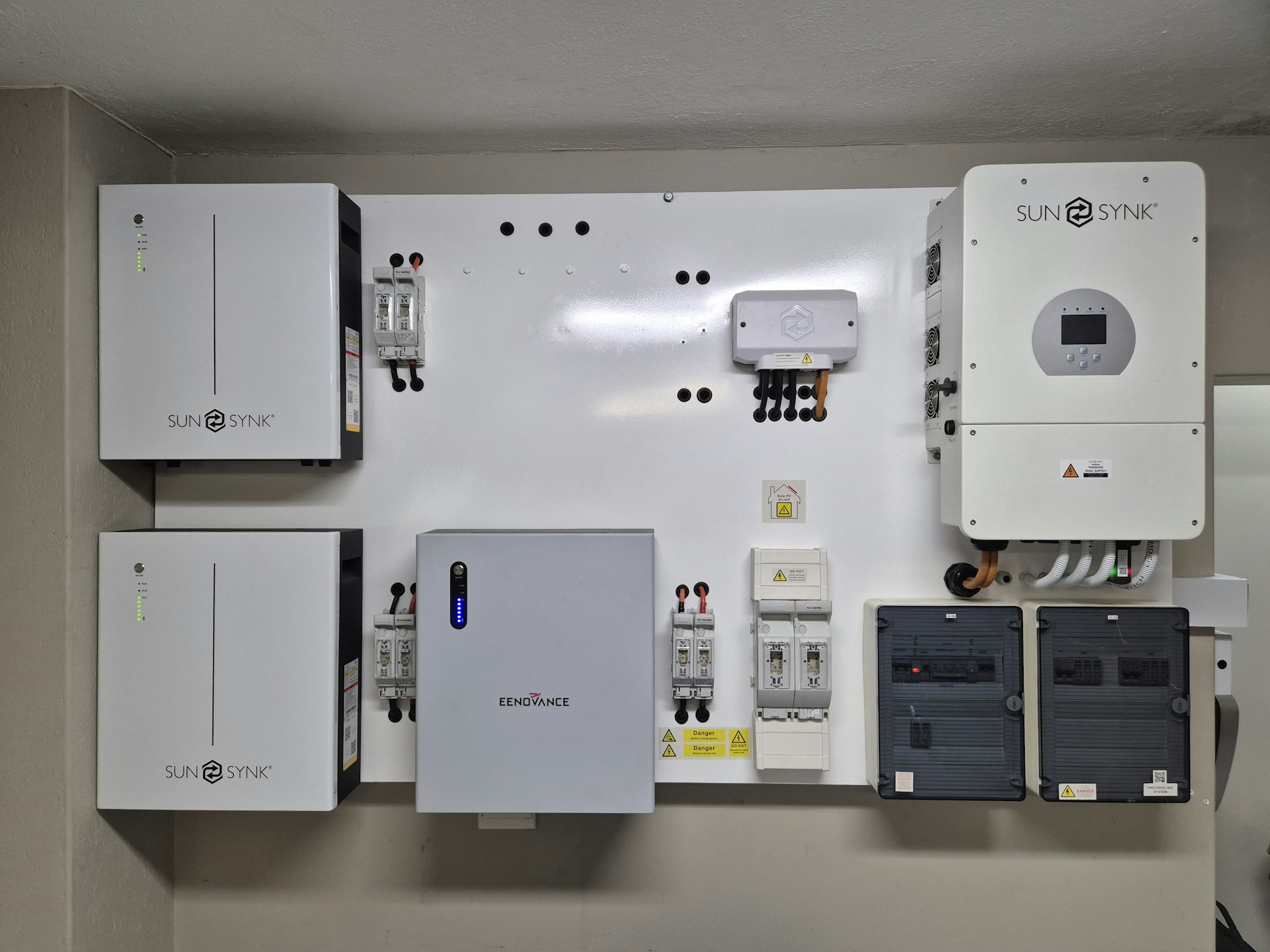 Wall-mounted solar and battery storage system installed on a home exterior wall